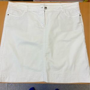 Boden white denim skirt, knee-length. Size 16 US. Button and zipper in front.